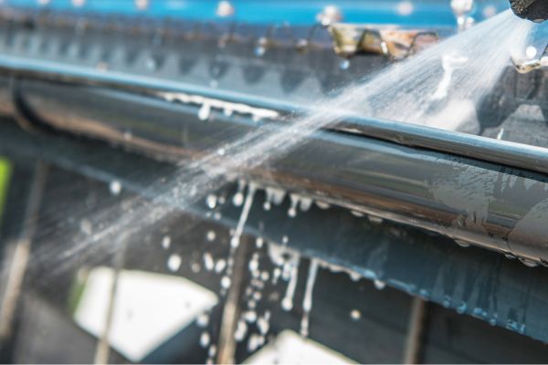 Expert Roof Cleaning Professionals Clearing And Washing Residential Gutters